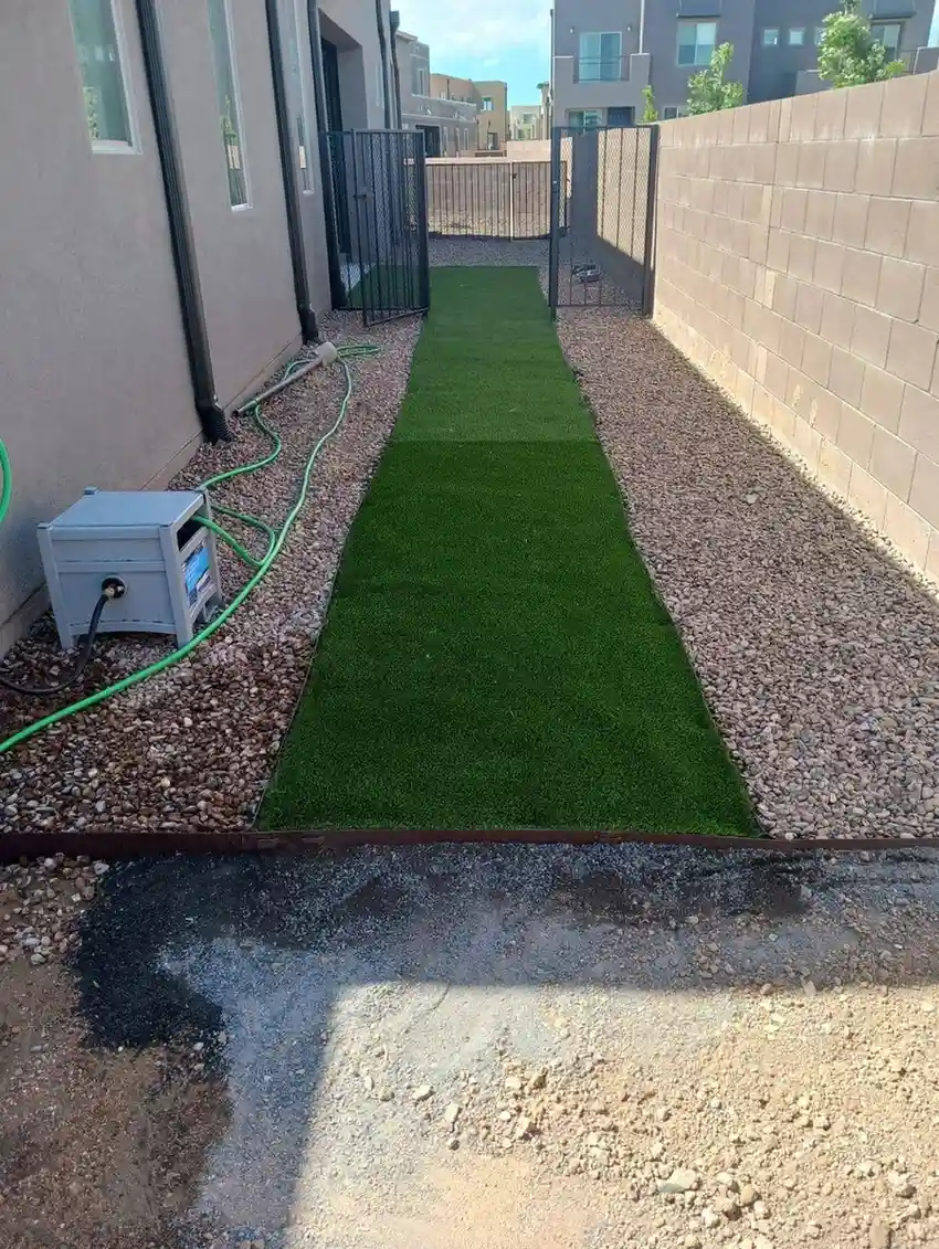 Backyard landscaping in Santa Fe with patio and native vegetation