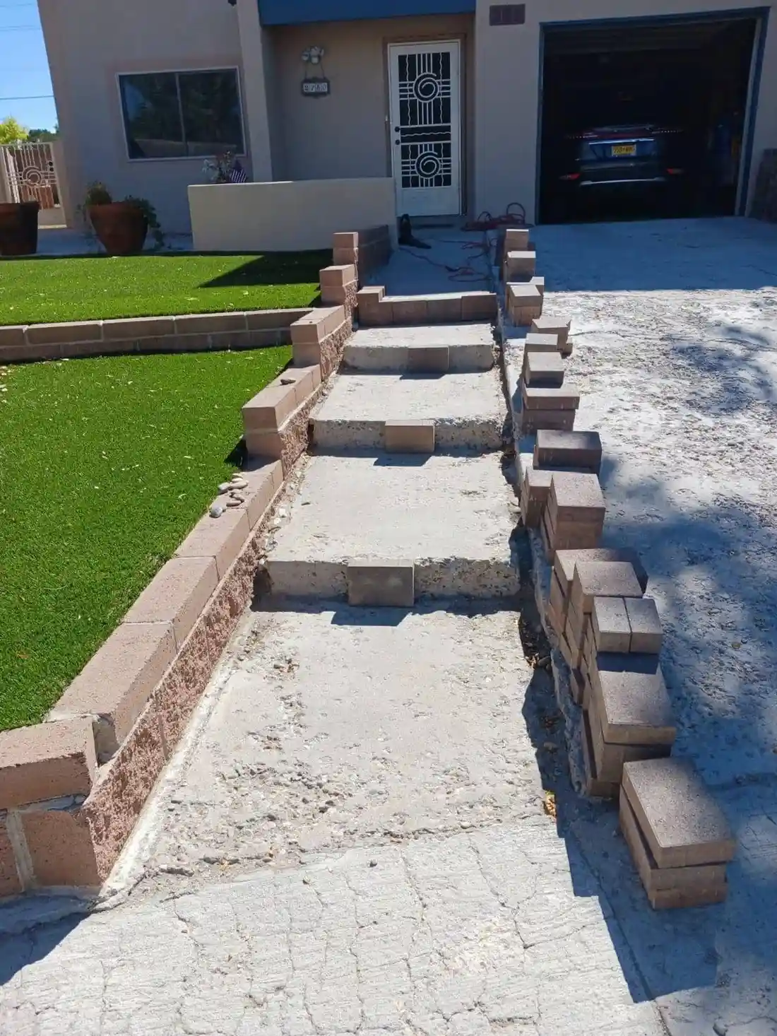 Santa Fe landscaping team building a natural rock garden